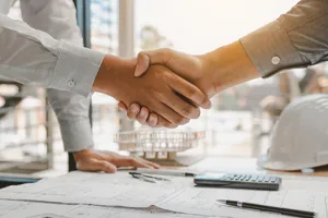 shaking hands after agreeing on building specifications